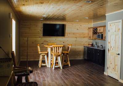 This bar and log table make entertaining in the lower level easy. 