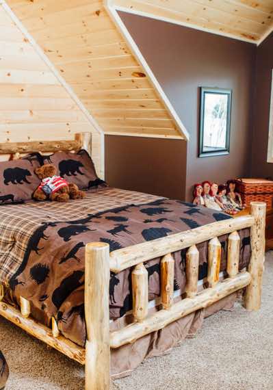 Log beds, knotty pine and some color in this bedroom in the loft. 