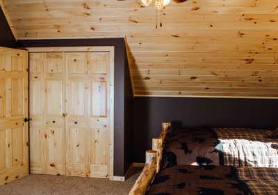A mix of pine and drywall in the loft bedroom.